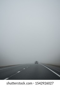 Heavy Fog On The Road. One Car In The Fog