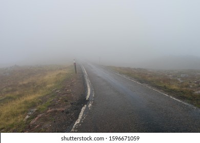 Heavy fog on the road. Scotland single track. Misty road.