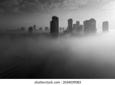 Heavy Fog In Tel Aviv. Black And Whita View Above. The City Over The Clouds