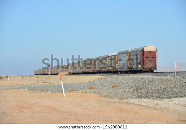 Heavy freight wagons left on the track at the\
Salton Sea in California