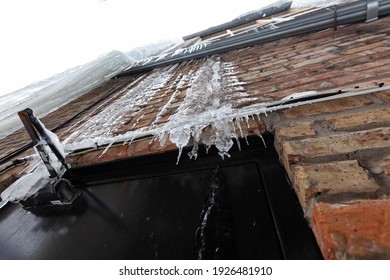 Heavy ice hanging from the roof