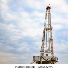 heavy industry oil drilling rig and blue sky - Shutterstock ID 2366522797