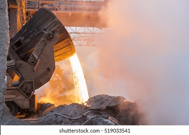 Heavy industry. Part of the process in metallurgy. Pouring the hot melt from the vat. - Shutterstock ID 519033541
