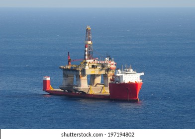 Heavy Lift Cargo Ship Transporting An Oil Rig