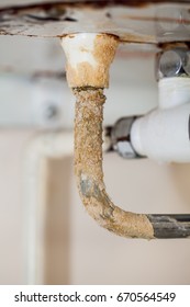 Heavy Limescale Deposit On A Rusty Hot Water System Pipe. Bad Plumbing Problem Cause By Hard Water Leaking.