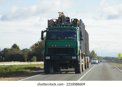 Heavy Loaded Timber Truck With Trailer On The Road