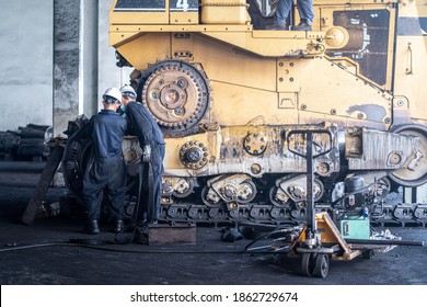 Heavy Machinery Maintenance And Repair, Mechanic Man Assembly Track Link Of The Bulldozer In Coal Power Plant