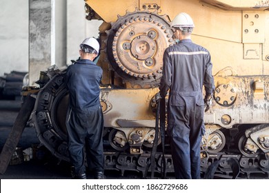 Heavy machinery maintenance and repair, Mechanic man assembly track link of the bulldozer in coal power plant - Shutterstock ID 1862729686