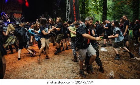 Heavy Metal Fans In A Mosh Pit Enjoying In Concert Of Their Favorite Band At Metaldays Festival On July 24th, 2017 In Tolmin, Slovenia