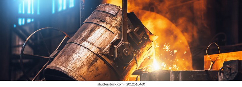 Heavy metallurgy horizontal banner background. Iron cast process. Liquid molten metal pouring into mold in foundry - Powered by Shutterstock