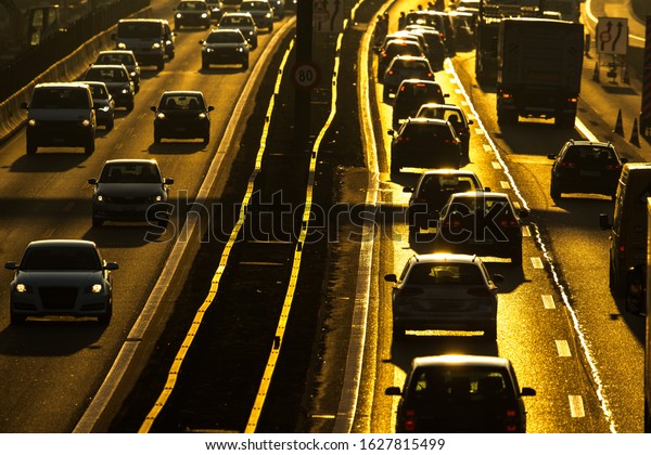 Heavy morning\
city traffic/congestion concept - cars going very slowly in a\
traffic jam during the morning\
rushhour