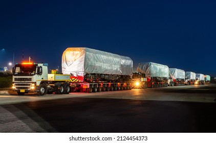 heavy oversize cargo truck Loading a new locomotive port area - Shutterstock ID 2124454373