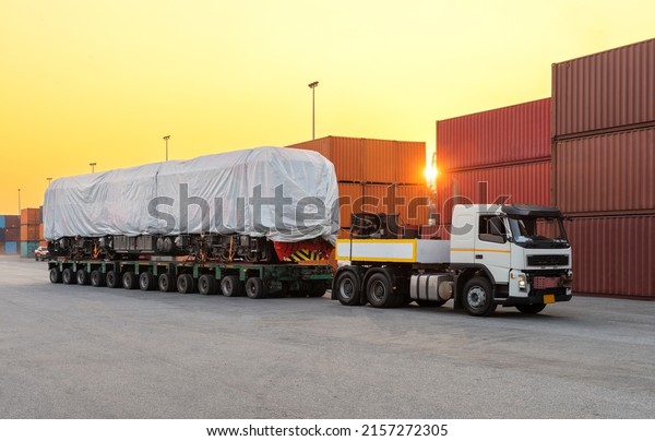 heavy\
oversize cargo truck Loading  new\
locomotive