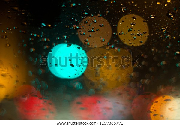 Heavy rain in the car at night makes for a\
beautiful light.