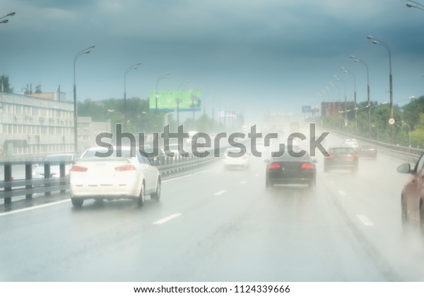 Heavy Rain Highway Traffic. Extreme Road\
Conditions. Rainy Weather\
Driving.
