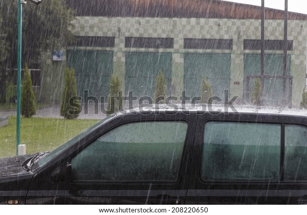 Heavy rain on car\'s\
roof
