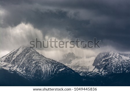 Heavy rain over mountains. Stormy weather.