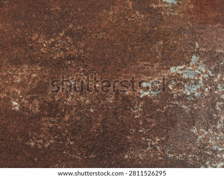 Heavy rust texture background. Dark brown corroded iron surface with weathered orange stains and blue peeling paint residues. Distressed industrial backdrop.
