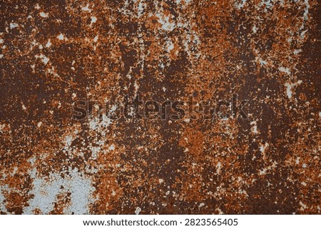 Heavy rusty metal texture background closeup. Highly corroded iron surface with flaking cracking white paint layers and deep orange brown rust, old industrial rustic wall material for grunge backdrop design.