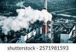 Heavy smog envelops industrial area with smokestacks releasing pollutants into the atmosphere