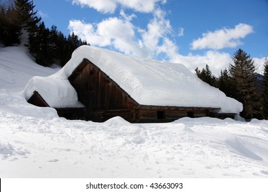 Heavy Snow On The Alpine Cottage