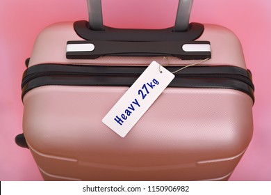 Heavy Tag On Pink Suitcase Or Luggage. Luggage Overweight Concept