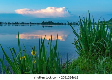 A heavy thunderstorm is approaching and is beautifully reflected in the smooth water of the Zoetermeerse Plas in Zoetermeer, the Netherlands