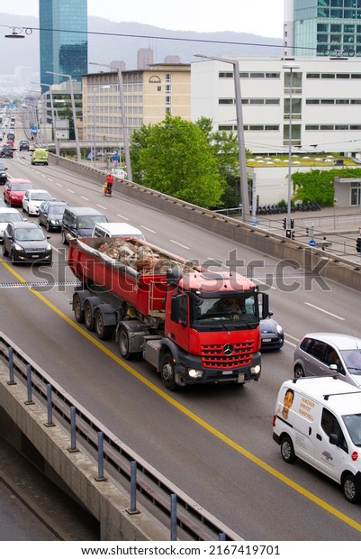 Heavy traffic at highway Hard Bridge at City\
of Zürich on a cloudy summer day. Photo taken June 3rd, 2022,\
Zurich, Switzerland.