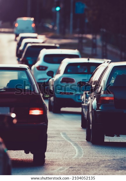 Heavy traffic,\
traffic jam in city at\
sunset