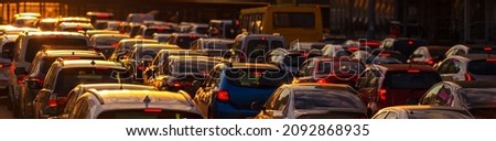 Heavy traffic jam during rush hour at sunset or dawn.