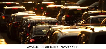 Heavy traffic jam during rush hour at sunset or dawn.
