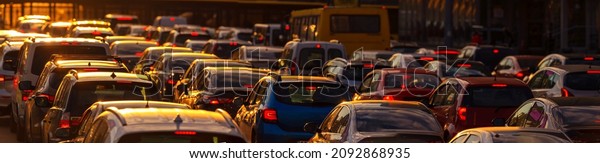 Heavy\
traffic jam during rush hour at sunset or\
dawn.