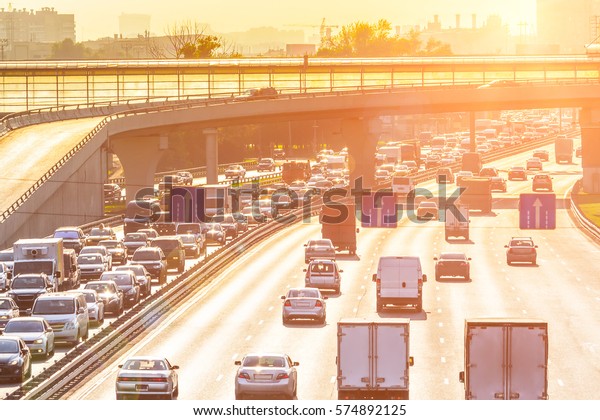 Heavy traffic on the\
highway with sunlight