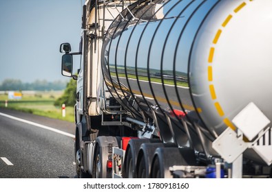 Heavy Transportation Industry. Moving Liquid Shipment. Tank Trailer Semi Truck on a Highway. 