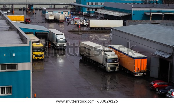 Heavy trucks loaded at the factory. Russia. Saint\
Petersburg, spring 2017. 