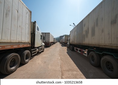 Heavy Trucks Loaded With Goods Trailers, Parked In Waiting Area On State Border Crossing In Vietnam