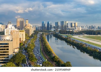 Heavy vehicle traffic on Marginal Pinheiros at dusk, Pinheiros River, sky with clouds, São Paulo, SP, Brazil, unpolluted river - Shutterstock ID 2159548969