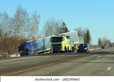 Heavy Wrecked Truck In The Roadside Ditch With Average Commissioner On Cr On Spring Day, Road Transport Accident Vehicle Crash 