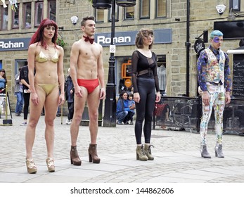 HEBDEN BRIDGE, UK - JUNE 2013: #Visitors Perform A Series Of Cheap Yet Glamorous Incidents In The Central Square Of Hebden Bridge To The Enhance Humdrum Realities  Of  Everyday Life, June 29th 2013.