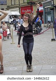 HEBDEN BRIDGE, UK - JUNE 2013: #Visitors Perform A Series Of Cheap Yet Glamorous Incidents In The Central Square Of Hebden Bridge To The Enhance Humdrum Realities  Of  Everyday Life, June 29th 2013.