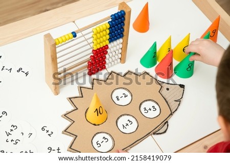 Hedgehog and numbers. Learning math. Calculation game for children. Early education. Montessori thematic tool for preschool children and people with special needs.
