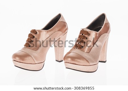 heeled shoes brown and bright pink with brown laces for women on white background