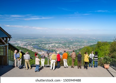 Heidelberg, Baden-Wuerttemberg, Germany, May 4, 2012: A Group Of Tourists Standing On Top Of The Königstuhl Mountain Looking Down At The City