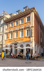 Heidelberg, Germany - Aug 1, 2020: Tourists Relax At Local Main Street Cafe