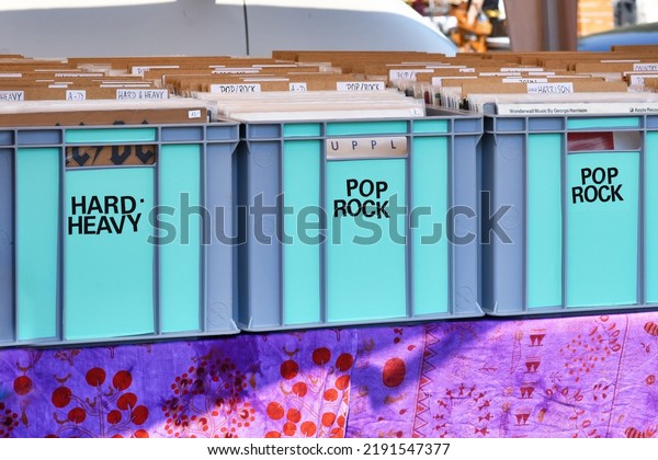 Heidelberg,\
Germany - August 2022: Boxes with old vinyl discs with music labels\
Hard, Heavy and Pop, Rock at flea market\
