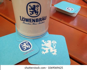 Heidelberg, Germany - August 24, 2017: Löwenbräu Beer Stein. Löwenbräu Is A Brewery In Munich Owned By Anheuser-Busch InBev. Its Name Means 