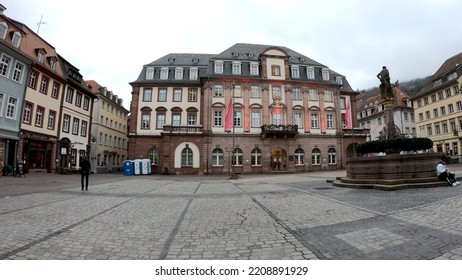 Heidelberg, Germany, December 9, 2021: Old Town Market Square (Heidelberger Marktplatz), Hercules Fountain And The City Hall Of Heidelberg - Centre Of Local Politics And The City Administration. 