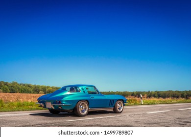 Heidenheim, Germany - August 18, 2019: Elegant Classic Oldtimer Luxury Sports Car On A Rural Road. Sunny Summer Weather, Blue Sky, Lots Of Copy Space. Travel, Freedom, Vacation Background Concept.