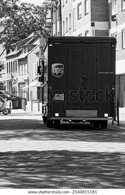 Heinsberg-NRW-Deutschland-05.25.2022: an ups post\
car parked on the side of the\
road