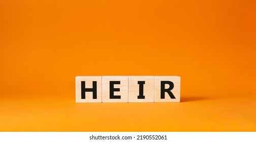 Heir symbol. Concept word Heir on wooden cubes. Beautiful orange background. Business and Heir concept. Copy space - Shutterstock ID 2190552061